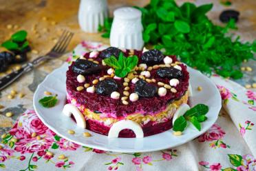 Holiday Genghis Khan Layered Salad with Prunes and Nuts