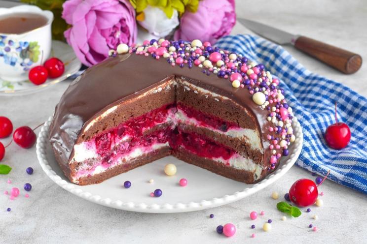 Decadent Chocolate Cake with Creamy Cheese Frosting and Cherry Topping