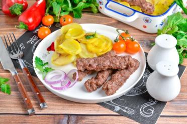 Oven-Baked Chevapchichi Sausages with Potatoes