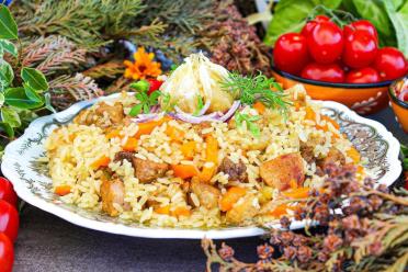 Hearty Uzbek Pork Pilaf in a Cauldron