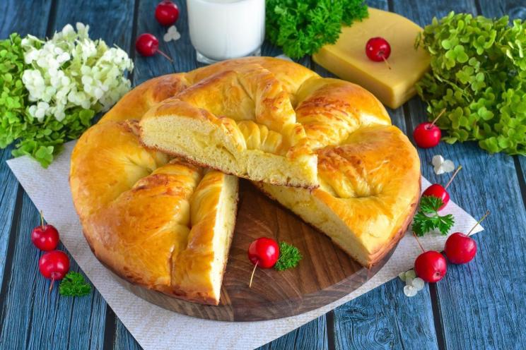 Cheese-Filled Yeast Dough Pie in the Oven