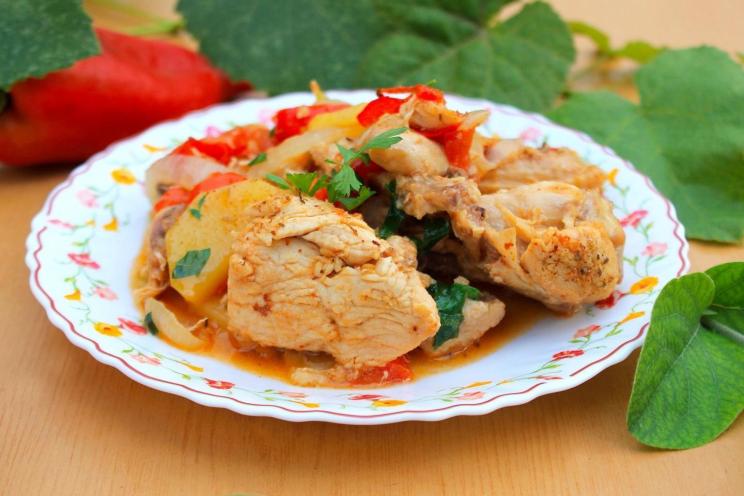 Smoky Chicken and Vegetables Cooked Over Fire