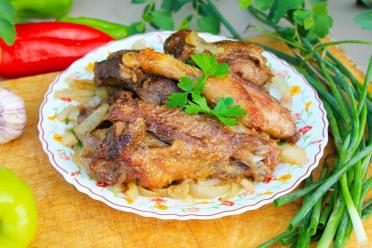 Smoky Fire-Cooked Duck with Onions