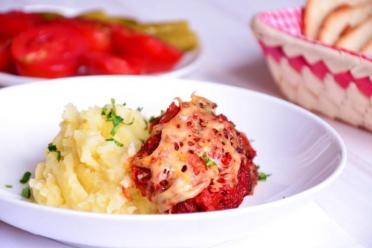 Oven-Baked Chicken Thighs with Tomato Sauce and Cheese