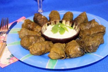Spicy Georgian Dolma with Mint in Grape Leaves and Matsoni Sauce